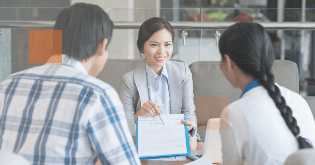 woman showing her paper to clients