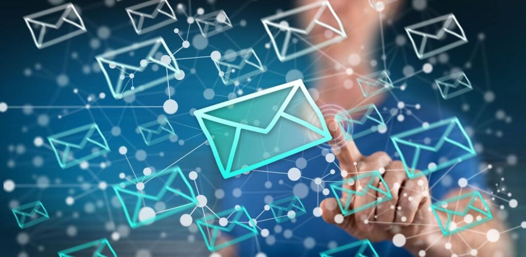 A person touching a hologram of an envelope as a representation of an email support specialist