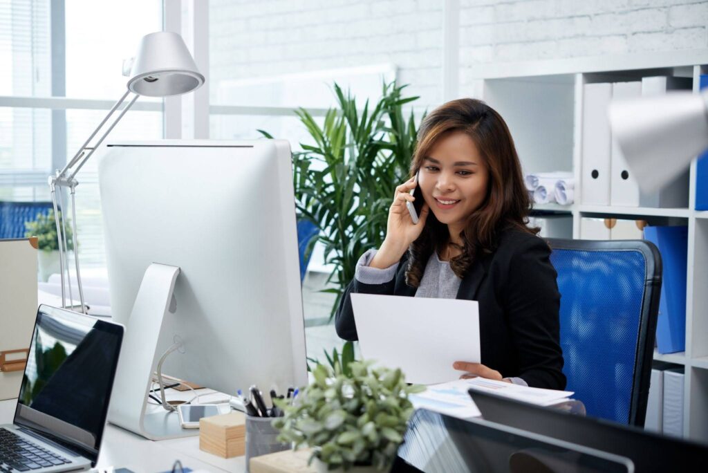 An outsourced Filipino professional taking care of insurance claims in her office