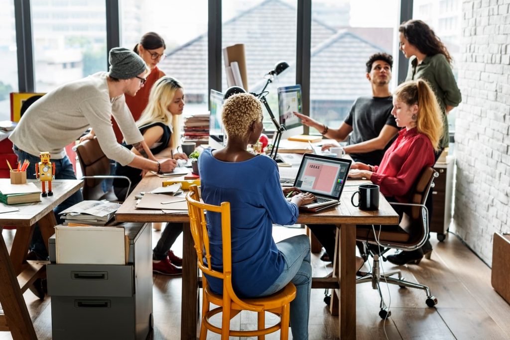 CIO and team evaluating IT outsourcing strategies, considering vendor selection and partnership alignment