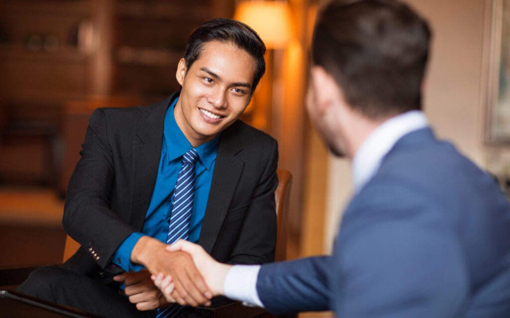 Shaking hands — Top BPO Solutions | Outsourcing Services In The Philippines