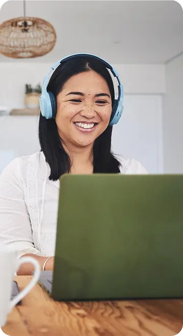 Happy woman working on her laptop computer