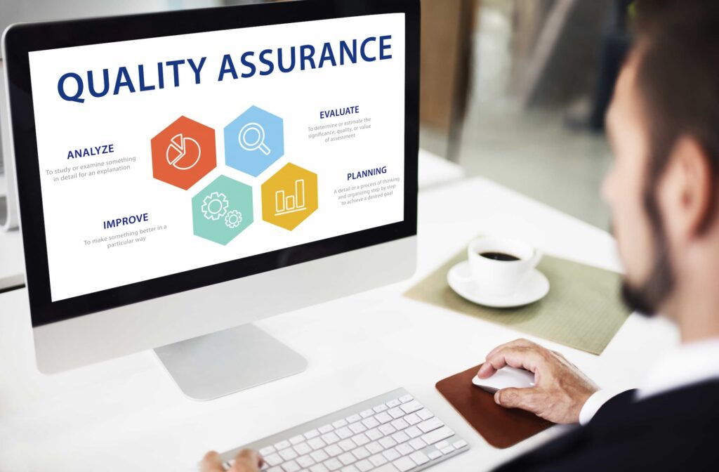 Quality assurance text on screen monitor — Top BPO Solutions | Outsourcing Services In The Philippines