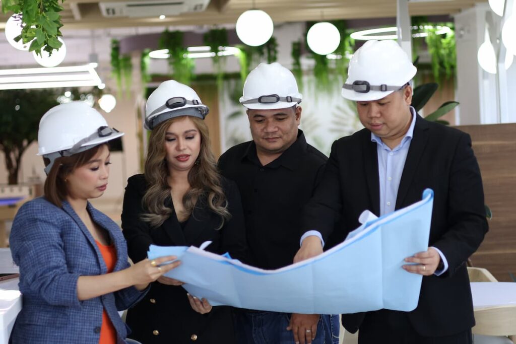 Sourcefit infrastructure team checking a document layout — Business process outsourcing & offshore staffing | Sourcefit