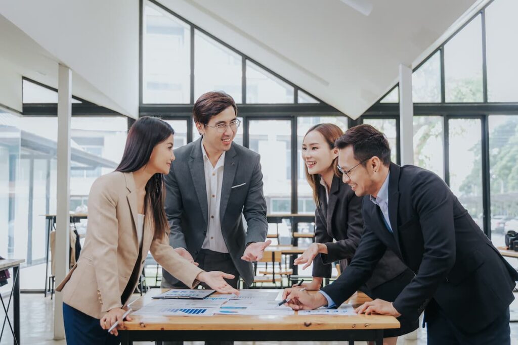 Happy team meeting — Business process outsourcing & offshore staffing | Sourcefit