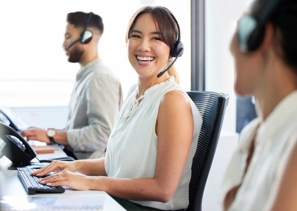 Smiling customer service agent — Top BPO Solutions | Outsourcing Services In The Philippines